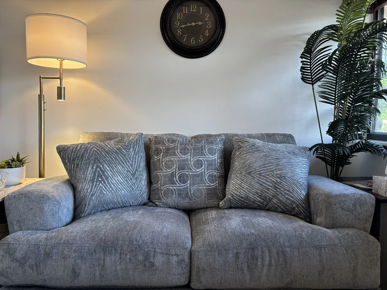 Soft couch seating with warm lighting in the couples counseling office in Littleton, Colorado