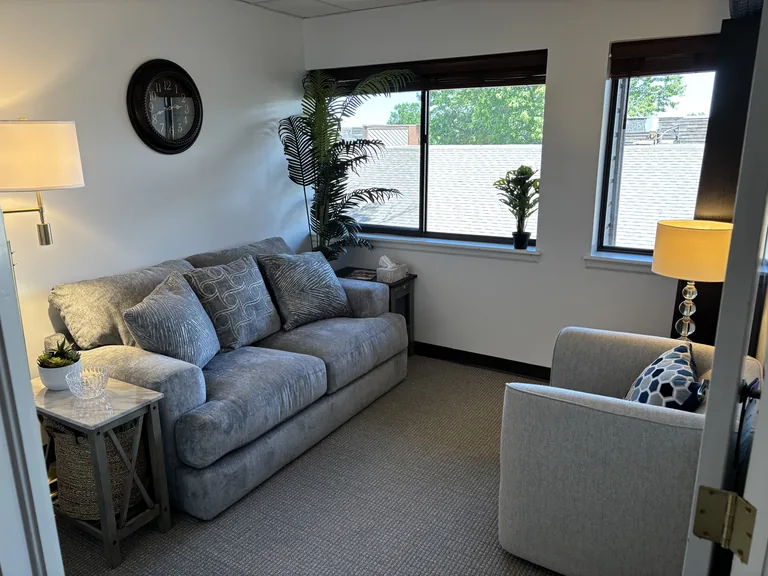 Private therapy room with a comfortable couch and armchair at Find Your Relationship in Littleton, CO