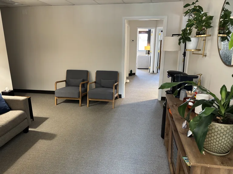 Welcoming waiting area with seating, plants, and natural light at the Littleton, CO office